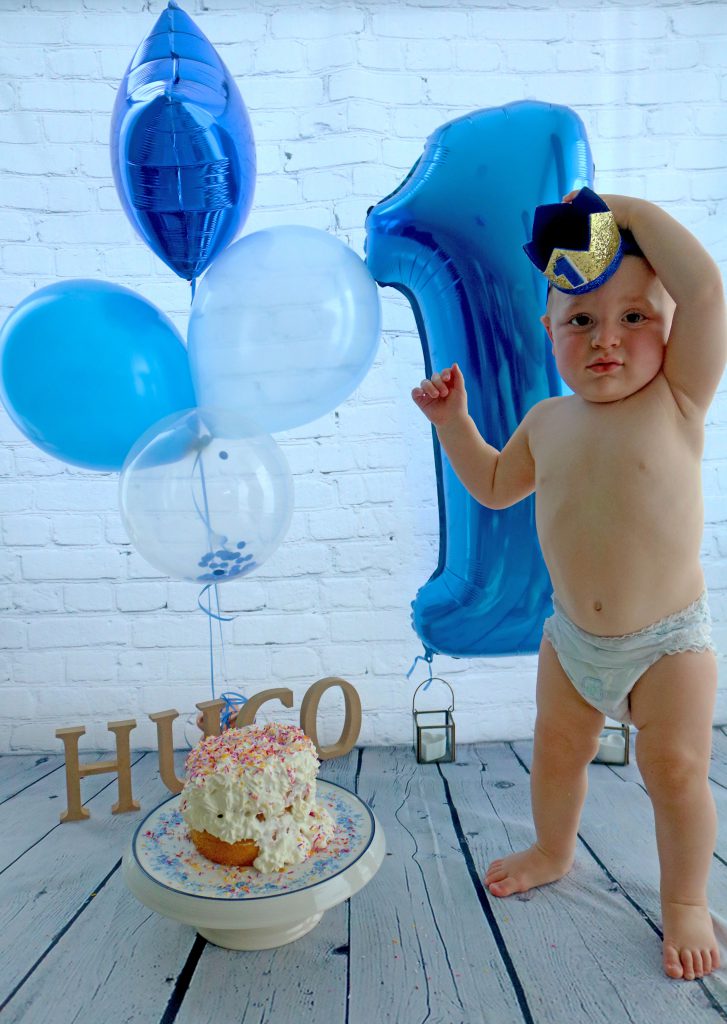 one year old boy with cake